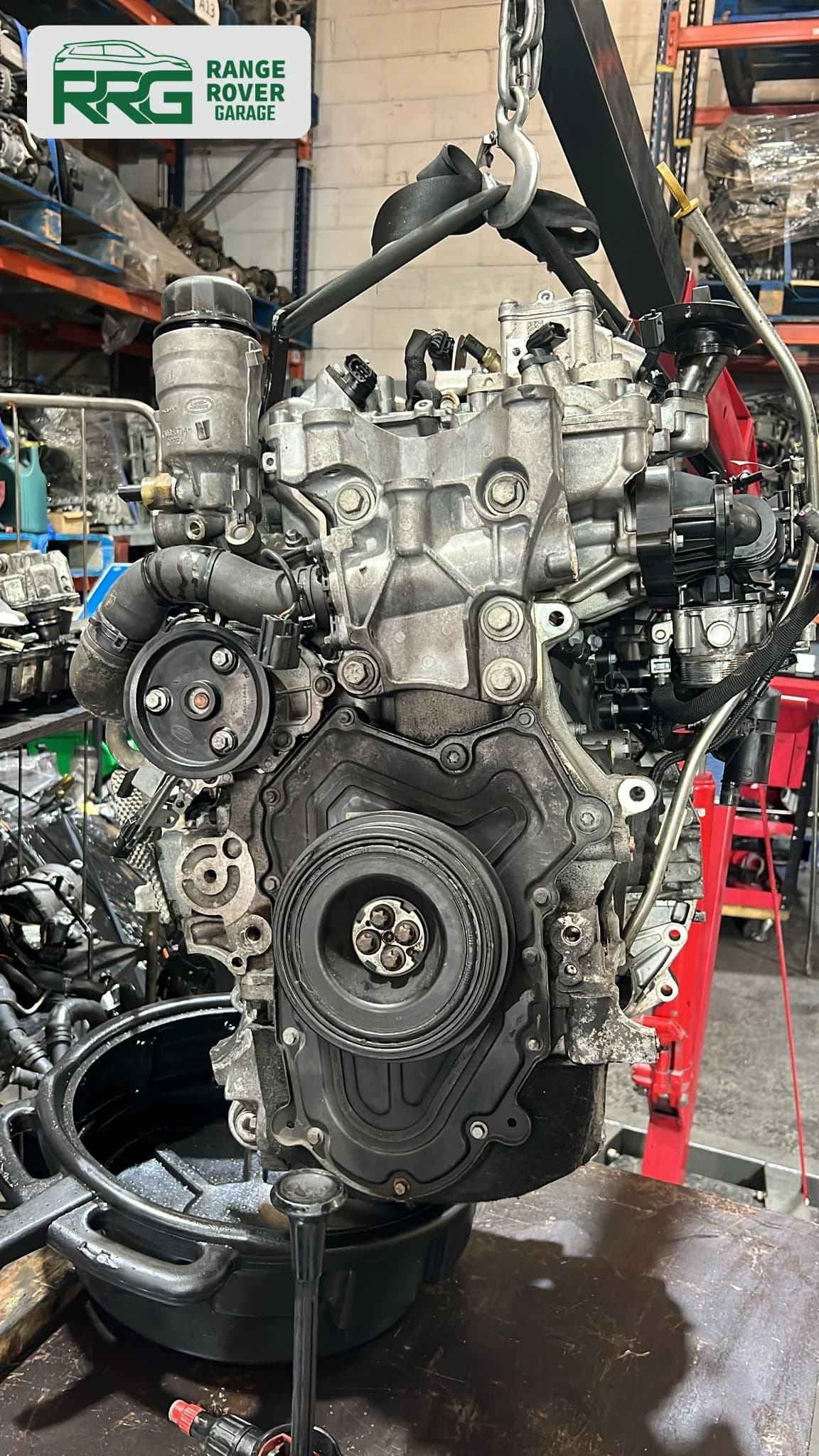 Removed engine showing pulleys and drive belt components