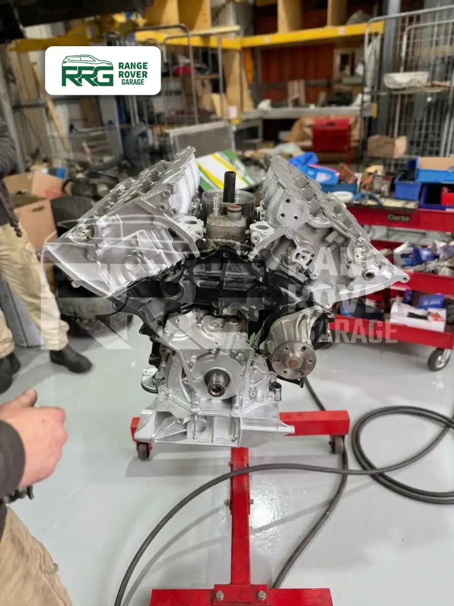 Engine mounted on a stand during rebuilding at Range Rover Garage