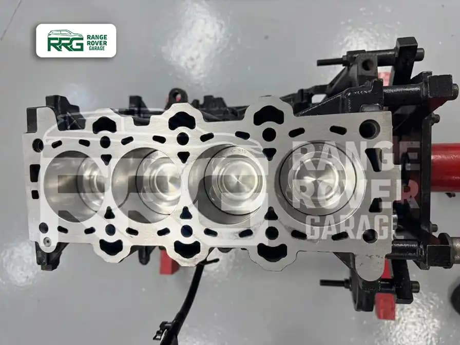 Engine block with the cylinder head removed and pistons exposed