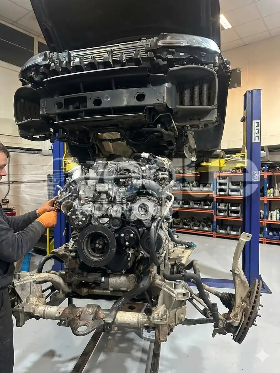 Supply and fit workshop with Range Rover engine being professionally fitted