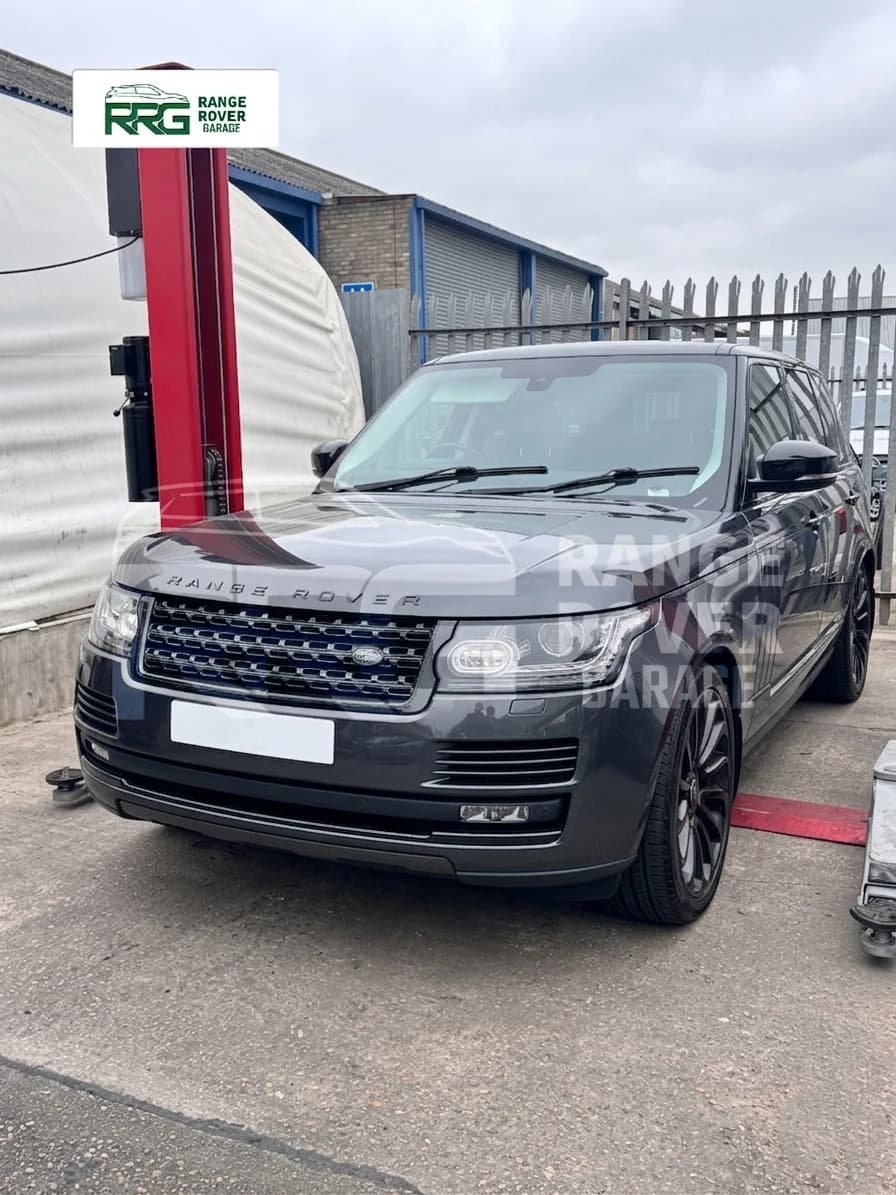 Range Rover parked beside the garage entrance