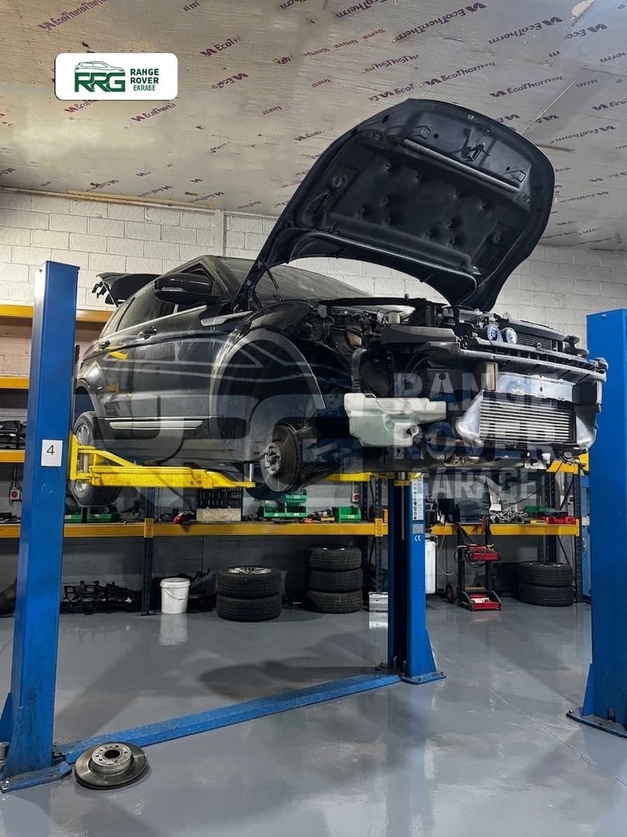 Range Rover on a workshop lift with its bonnet raised