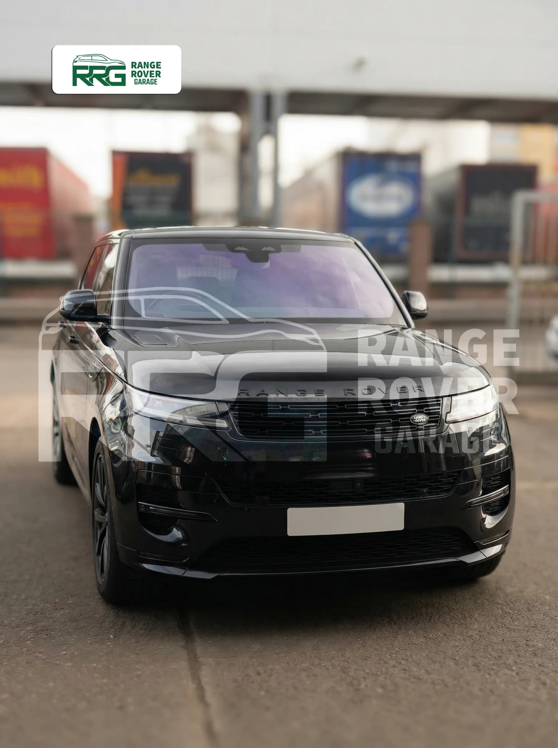 Black Range Rover parked outside the garage